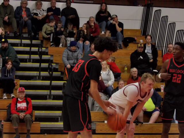 Basketball player dribbling the ball on court