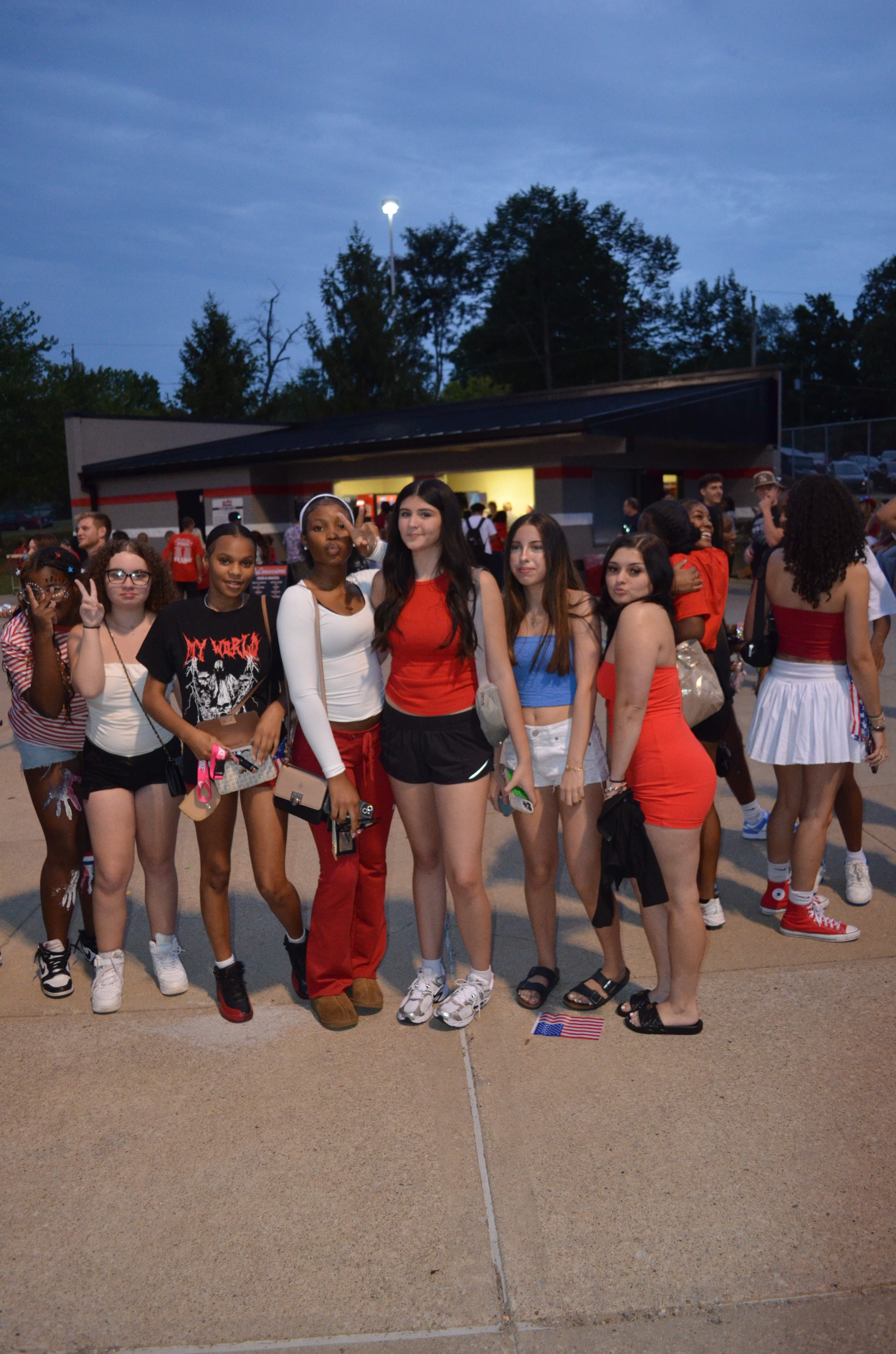 Group of New Albany High School students showing school spirit at football game